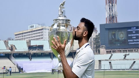 Jaydev Unadkat with the trophy.