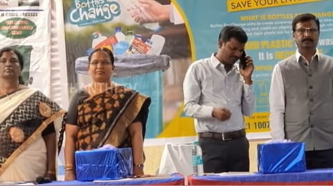 CEO Raman speaking on phone during national anthem