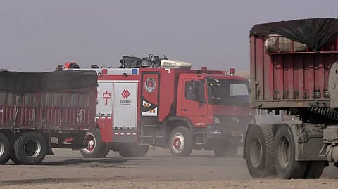 A fire truck drives through a checkpoint
