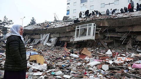 People search for survivors under the rubble following an earthquake in Diyarbakir
