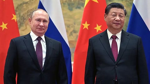 Chinese President Xi Jinping, right, and Russian President Vladimir Putin pose for a photo prior to their talks in Beijing, China.