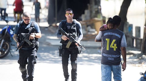 Police officers patrol the Jacarezinho slum
