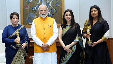 Prime Minister Narendra Modi with film maker Kartiki Gonsalves and producer Guneet Monga