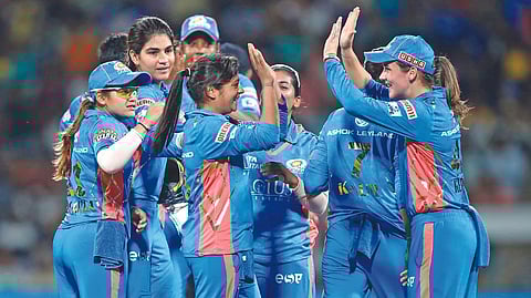 Mumbai Indians exult after its win over UP Warriorz.