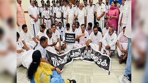 Kerala Opposition legislators protest in front of Speaker A N Shamseer's office