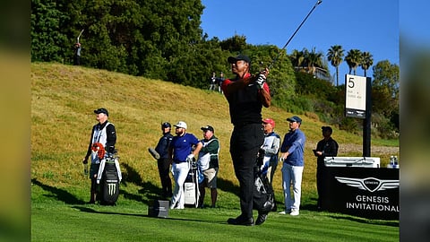 Tiger Woods hits from the fifth hole tee during the final round of The Genesis Invitational golf tournament
