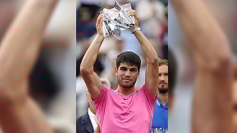 Carlos Alcaraz with the title
