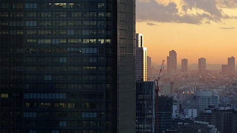 High-rise office buildings are seen during sunset in Tokyo