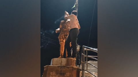 Visual from the video of the boy desecrating Subhash Chandra Bose's statue at Sipat Chowk.