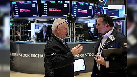 Traders work on the floor of the New York Stock Exchange (NYSE) in New York City