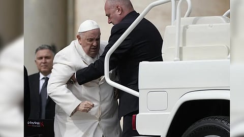 Pope Francis is helped into his car at the end of the weekly general audience in St. Peter's Square, at the Vatican, Wednesday, March 29, 2023.