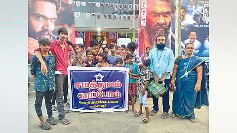 Narikurava community
members outside the theatre
