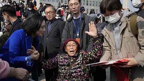 South Korean forced labor victim Yang Geum-deok, bottom center