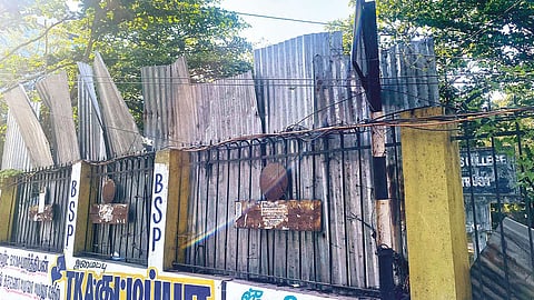 Rusted iron sheets seen on the compound wall of a college in Guindy
