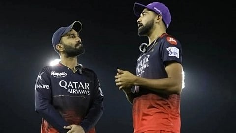 Dinesh Karthik with Mohammed Siraj