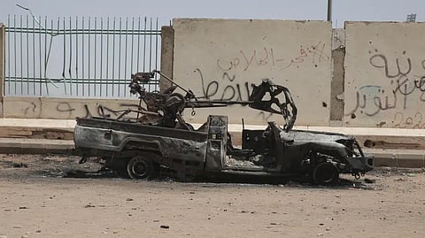 A destroyed military vehicle is seen in southern in Khartoum, Sudan, Thursday, April 20, 2023.