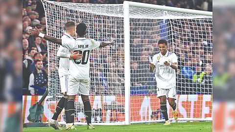 Real Madrid players celebrate scoring a goal in the second leg