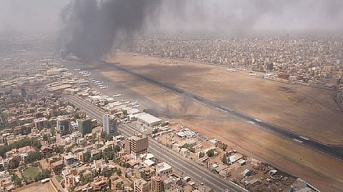 Smoke rises over the city as army and paramilitaries clash in power struggle, in Khartoum.