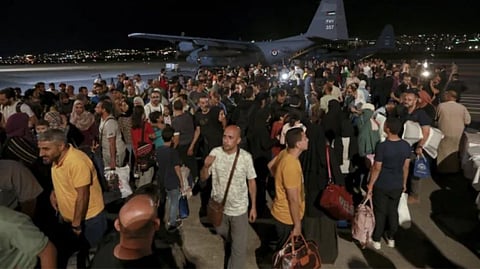 Civilians evacuated from Sudan arrive at a military airport in Amman, Jordan, on Monday. Foreign powers have sought to use a lull in fighting to get citizens out.