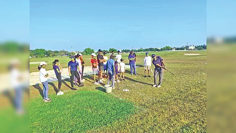 Coach Pradhyumna shows learners the correct finish