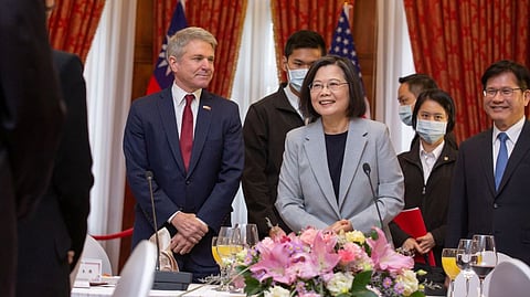 Taiwan President Tsai Ing-wen stands next to Michael McCaul, Chairman of the U.S. House Foreign Affairs Committee, who is leading a delegation of US lawmakers visiting Taiwan, during a lunch meeting in Taipei, Taiwan, in this handout picture released on April 8, 2023