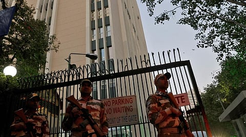 Security personnel outside the building housing BBC offices in New Delhi.