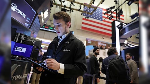 Traders work on the trading floor at the New York Stock Exchange (NYSE) in New York City