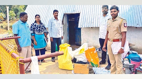 Officials with the seized raw materials for bomb making