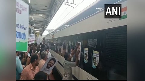Congress workers pasting posters of Palakkad MP VK Sreekandan