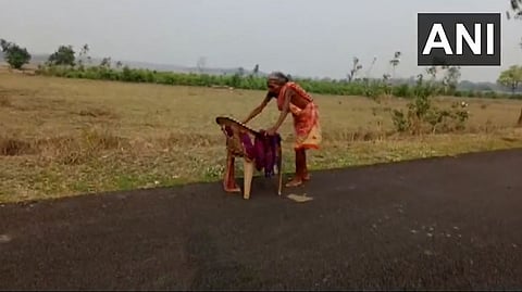 Screengrab from the video of the women walking barefoot on the road.