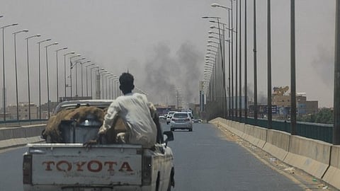Smoke rises near Halfaya Bridge between Omdurman and Khartoum North in Sudan on Saturday.
