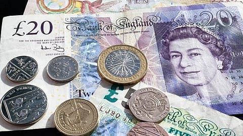 Sterling falls as inflation squeezes British consumers
