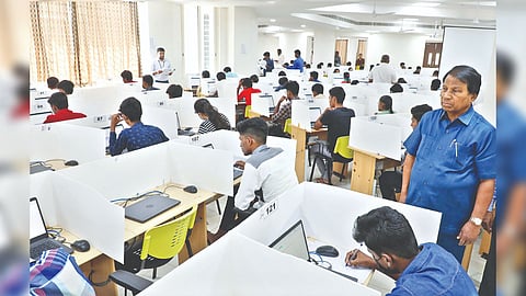 VIT University Chancellor G Viswanathan overseeing students writing the entrance exams in Vellore