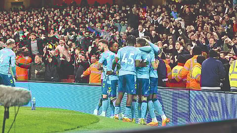 Southampton players celebrate their second goal against Arsenal