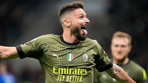 Milan's Olivier Giroud celebrates after scoring his side's opening goal soccer match between AC Milan and Empoli at the San Siro stadium, in Milan, Italy