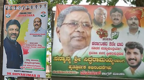 Supporters of Siddaramaiah and DK Shivakumar put up posters outside the leaders' house.