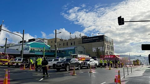 Fire and emergency crews work at the scene of a fire at the Loafers Lodge, in Wellington.