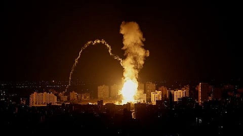 Smoke rises following an Israeli air strike in Gaza