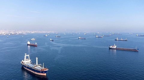 Commercial vessels including vessels which are part of Black Sea grain deal wait to pass the Bosphorus strait off the shores of Yenikapi during a misty morning in Istanbul
