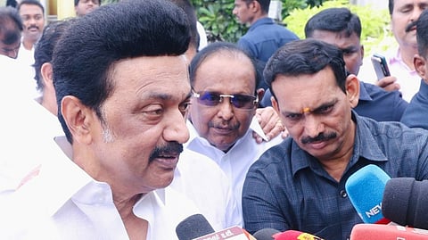 CM Stalin speaking to reporters at Marina Beach after visiting and paying his respects to memorials of CN Annadurai and M Karunanidhi on Sunday.