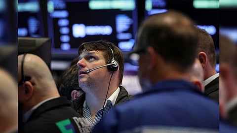 Traders work on the floor of the New York Stock Exchange (NYSE) in New York City