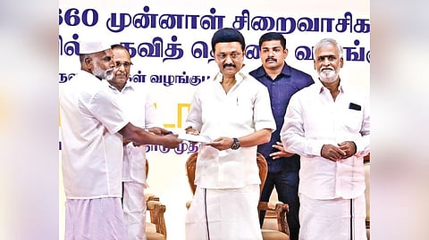 Chief Minister MK Stalin handing over financial aid to a released prisoner in Chennai on Friday