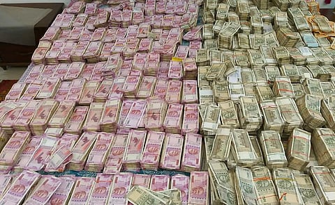 The seized cash from the premises belonging to Rajender Gupta