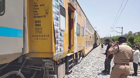 The derailed coach of double-decker train near Bisanattam station, 20km from Bangarpet