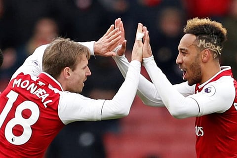 Arsenal's Nacho Monreal and Pierre-Emerick Aubameyang celebrate after the match