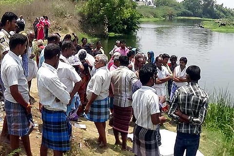 Villagers gather on the river banks after the tragedy