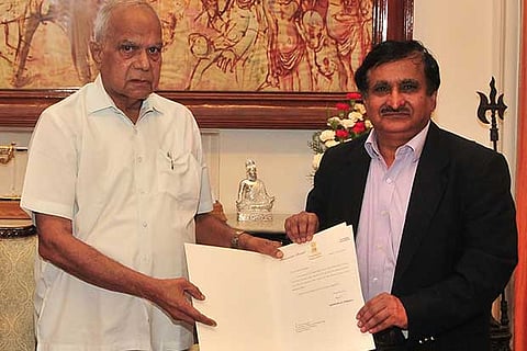 Tamil Nadu Governor Banwarilal Purohit hands over the letter of appointment to Dr Surappa