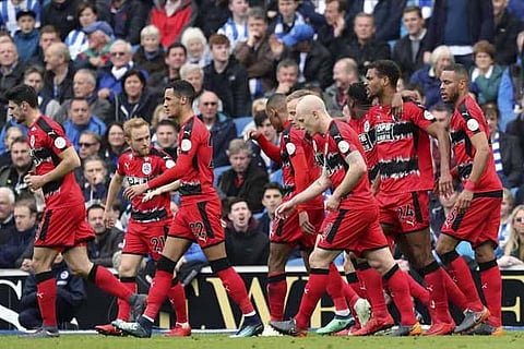 Huddersfield Town's players celebrate after scoring