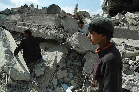 Syrian civilians search for survivors amid the rubble of buildings that were destroyed.(File photo)