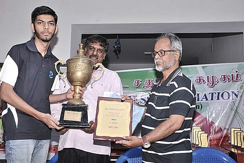 Vignesh receives the award